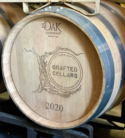 a wine barrel with the grafted cellars logo